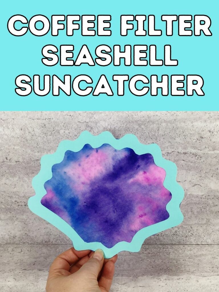 White text outlined in black on a light blue background at top of image says Coffee Filter Seashell Suncatcher. Below text is a finished coffee filter seashell suncatcher craft for kids held in a hand against a gray stone background.