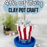 Top of image has black and white text over a blue watercolor splash that says 4th of July Clay Pot Craft. A small clay flower pot and saucer are painted red, white, and blue to look like Uncle Sam's hat. It is filled with white crinkle paper and Hershey's kisses.