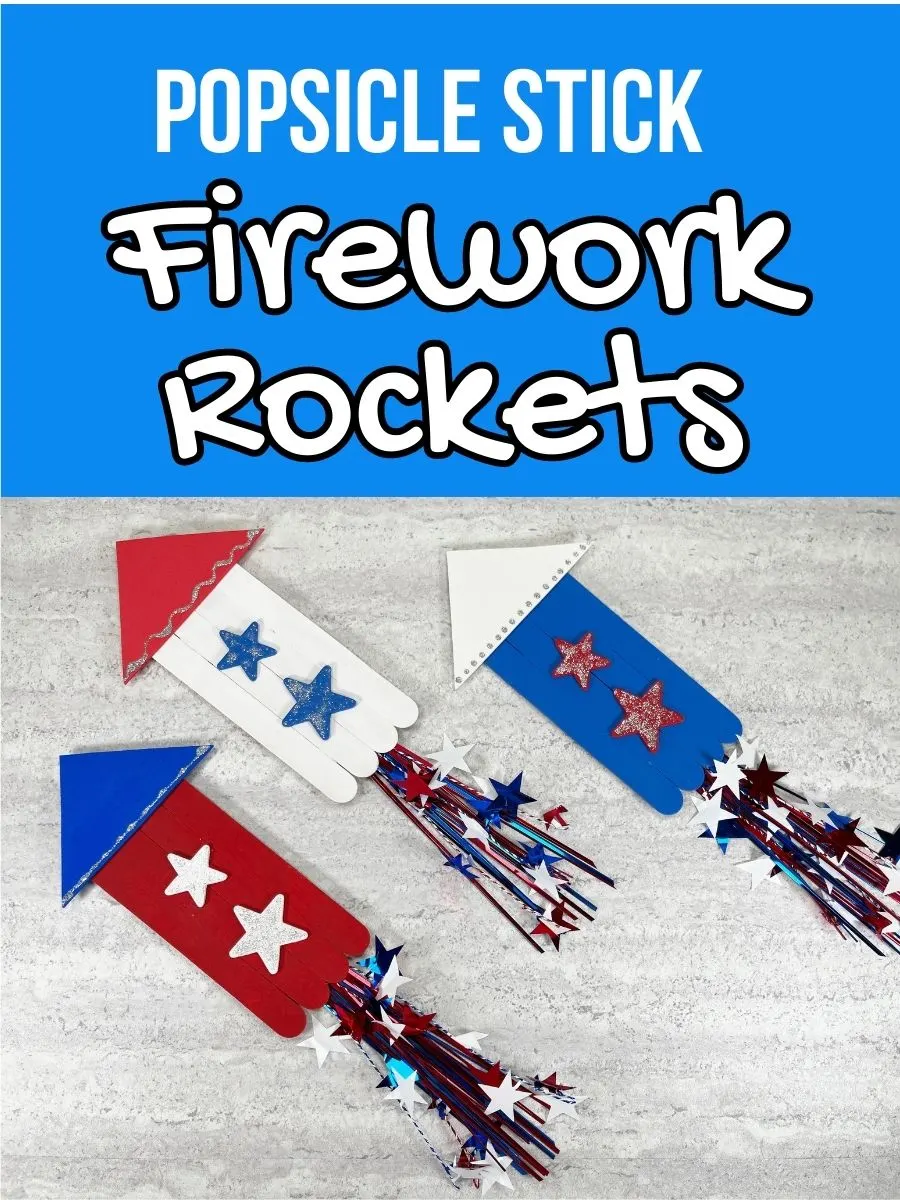 White text on light blue background says Popsicle Stick Firework Rockets. Photo underneath shows three completed red, white, and blue rockets angled up toward the top left as if blasting off into the sky.