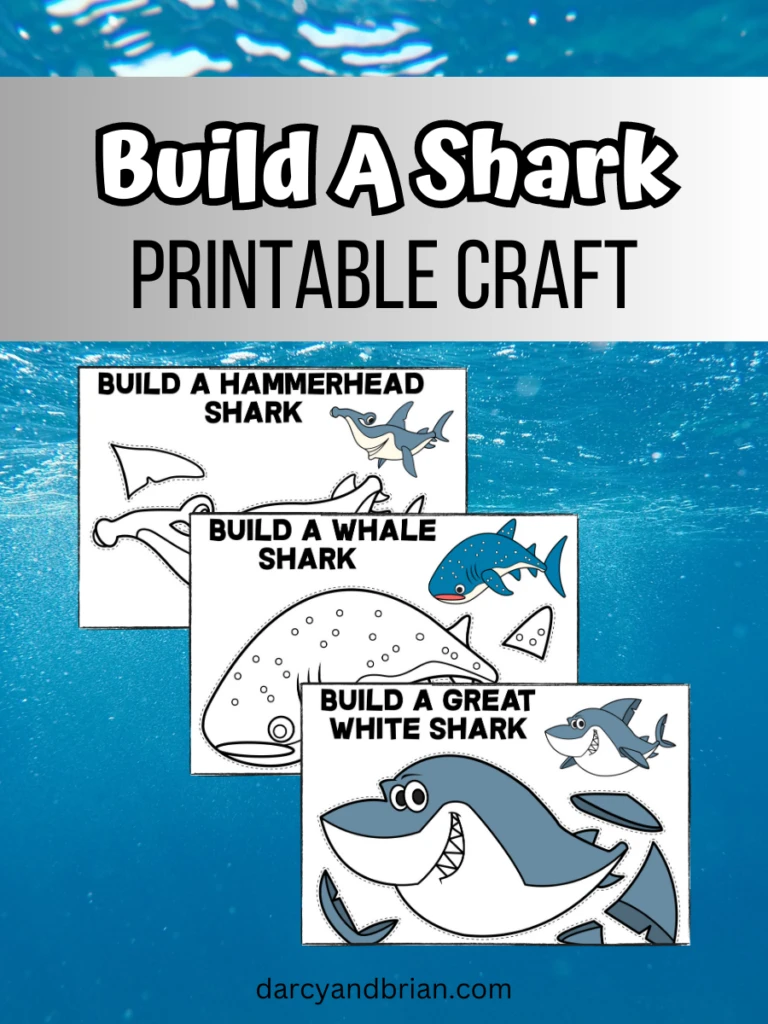 Mockup with preview image of three different sharks from printable set. A full color Great White Shark, a black and white Whale Shark, and a black and white Hammerhead Shark. The printable pages are on a water background. The top has a gray gradient text box with the words Build A Shark Printable Craft at the top.