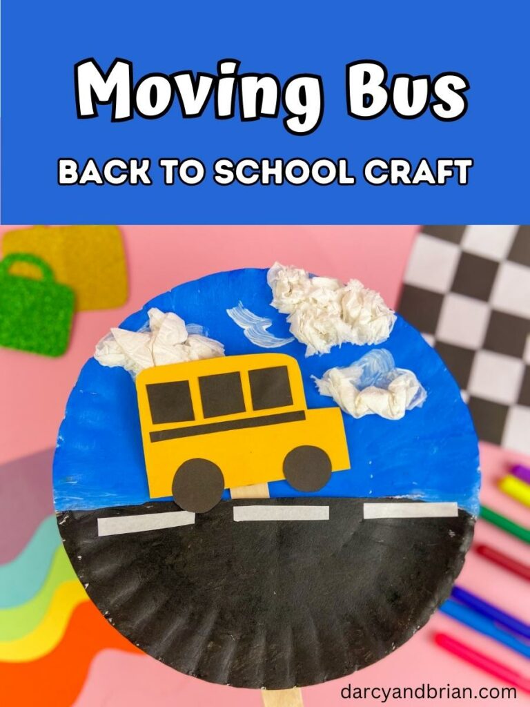 Dark blue text box at the top with white text says Moving Bus Back to School Craft. Photo beneath shows a paper bus on a stick inside a slit in a blue and black painted paper plate to look like the bus is driving on the road.