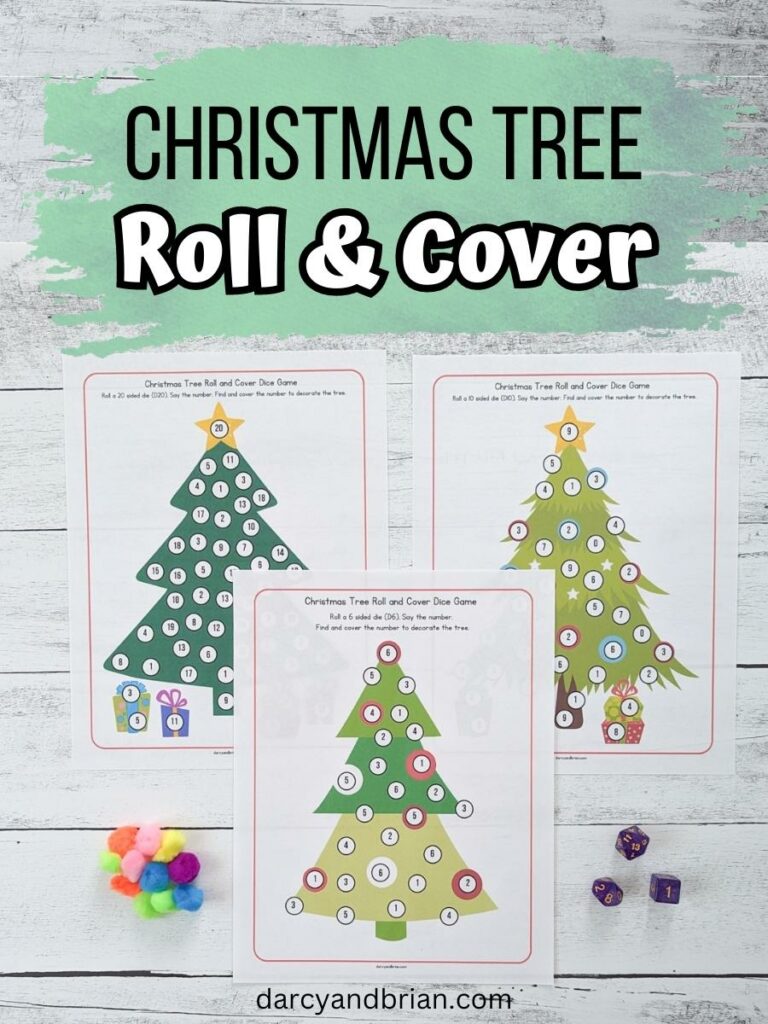 Black and white text at the top over a mint green splash says Christmas Tree Roll & Cover. Below is a photo of three Christmas tree dice game pages printed out. A pile of pom poms is on the bottom left and three dice on the bottom right.
