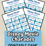 Preview of four pages of Disney Movie Charades word cards overlapping each other on a desk background.