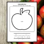 Mockup of tissue paper apple craft template on a background with a bunch of red apples on it.