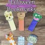 Overhead view of six different Halloween bookmarks cut out and arranged on table next to markers. Two are full color versions and the rest were colored in.
