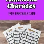 Top part of image has white and black text on a purple background that says Halloween Charades Free Printable Game. There is a spider and web decorating the top corners. Below that is a photo of the printable sheets printed and fanned out on a table.