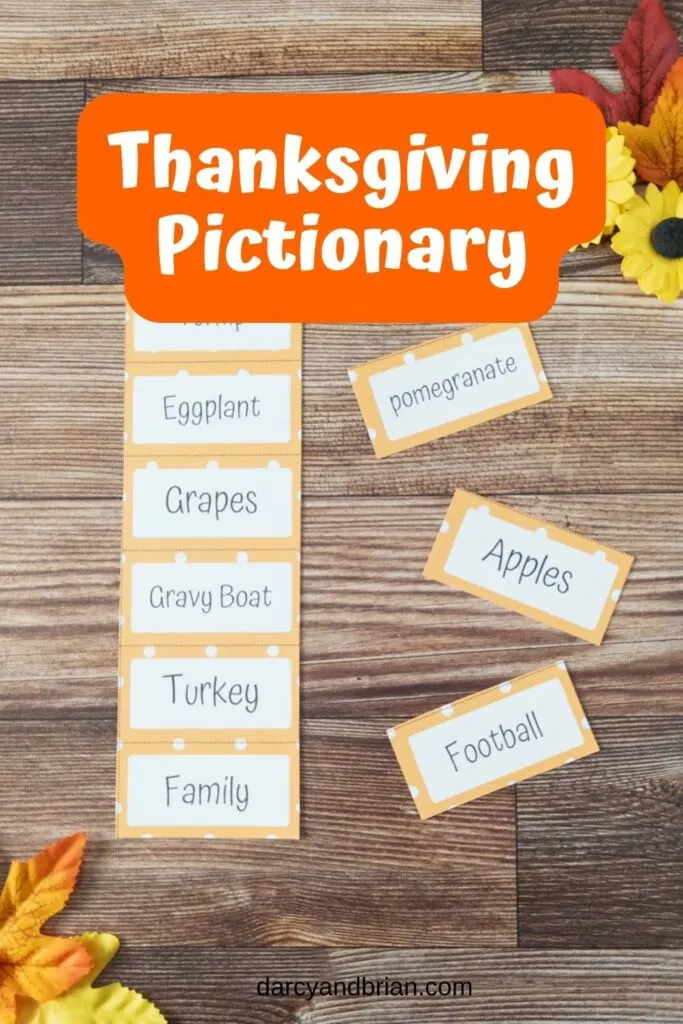 One column of Thanksgiving themed word cards from printable cut out and three individual cards cut out and laying next to it. White text on orange background says Thanksgiving Pictionary at the top.