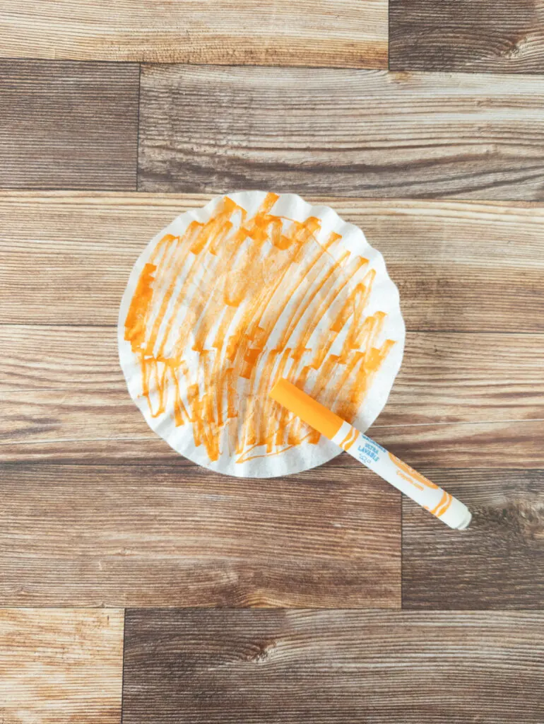 Coffee filter colored with an orange marker.