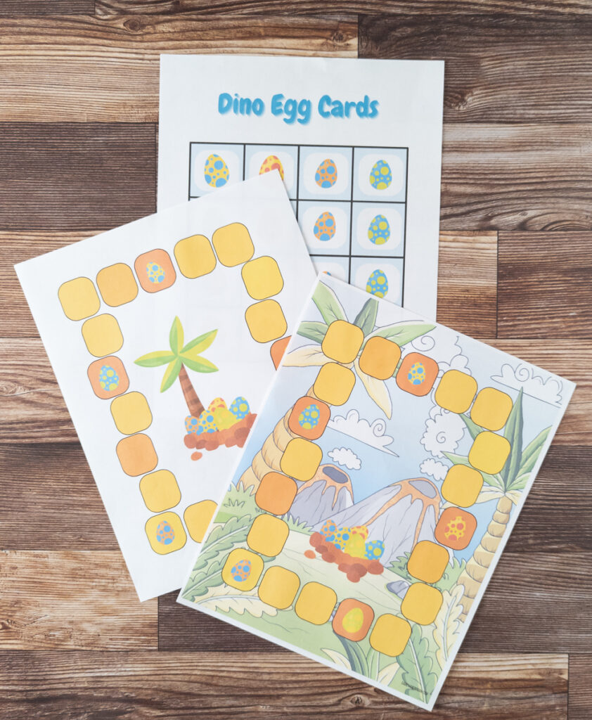 Both dinosaur game boards printed out and the dino egg cards.