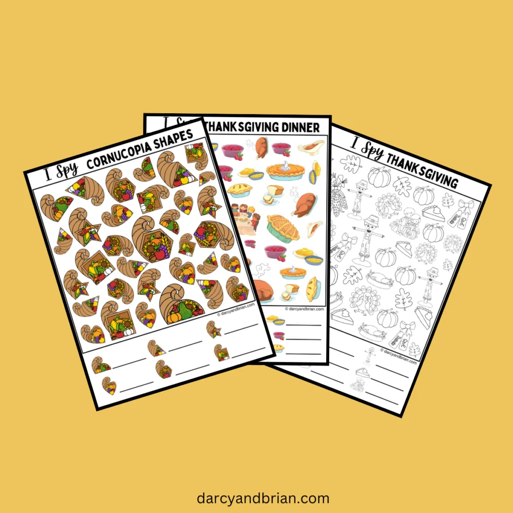 Preview of all three I Spy Thanksgiving printable pages fanned out on a mustard yellow background.