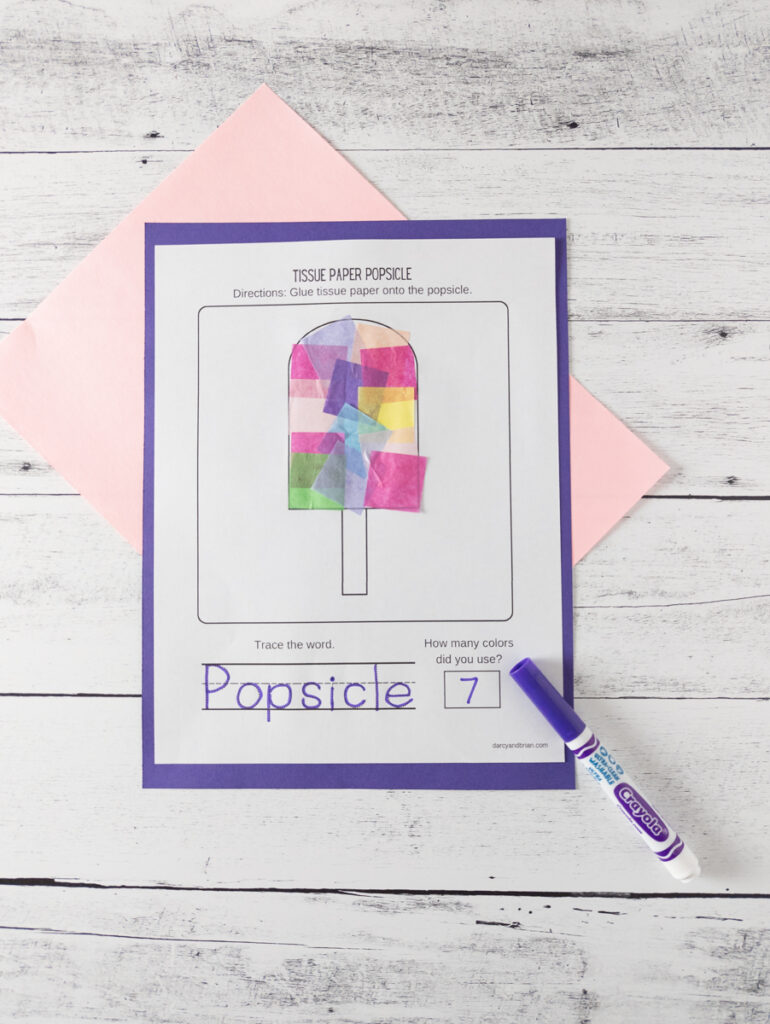 Popsicle template filled in with tissue paper the rest of the way. Purple marker used to trace the word.