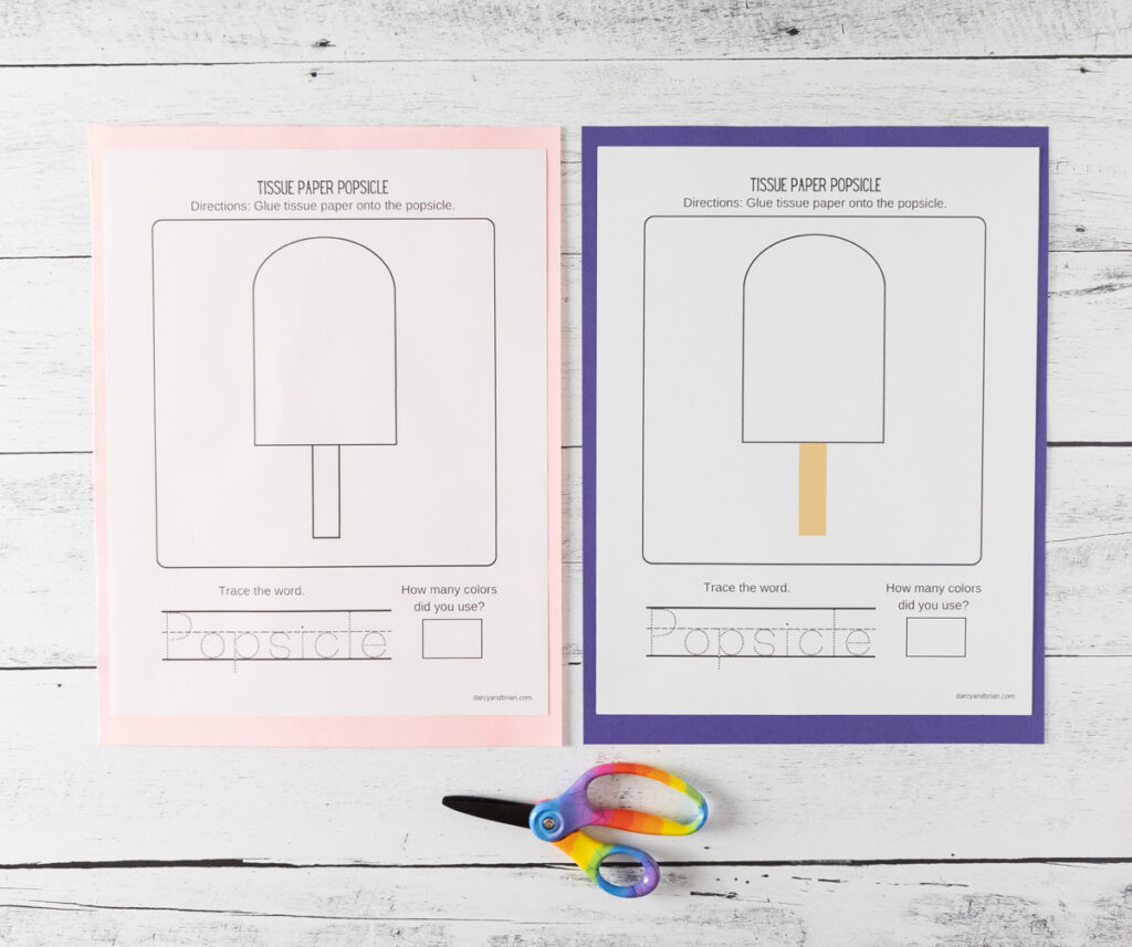 Blank popsicle craft templates printed out and laying side by side on top of pink and purple papers.