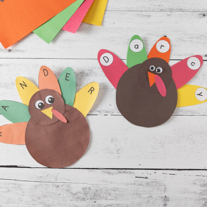 Two complete paper turkey name crafts beside each other. One made from the full color printables and one made with construction paper.