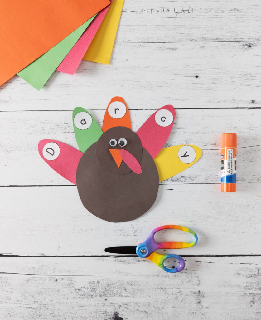 Completely assembled paper turkey name craft. The name the feathers spell is Darcy.