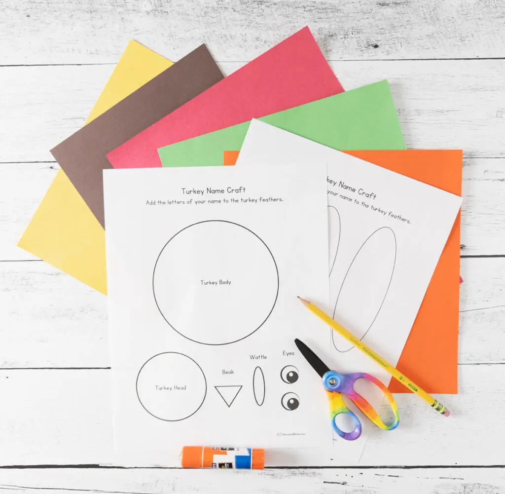 Turkey name craft templates, assorted colors of construction paper, pencil, scissors, and glue stick.