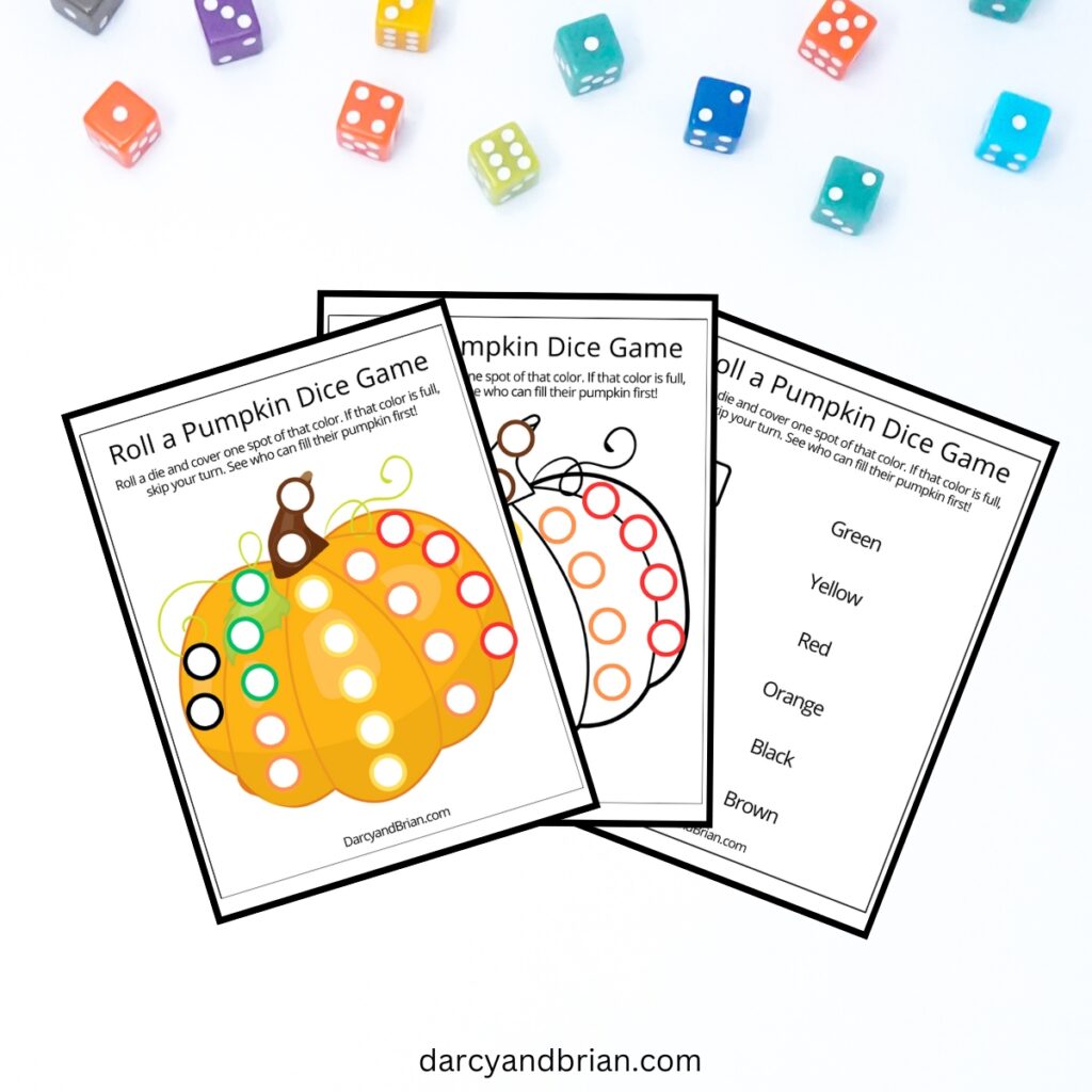 Mockup of the roll a pumpkin dice game with the three pages fanned out on a white background with colorful dice scattered along the top.