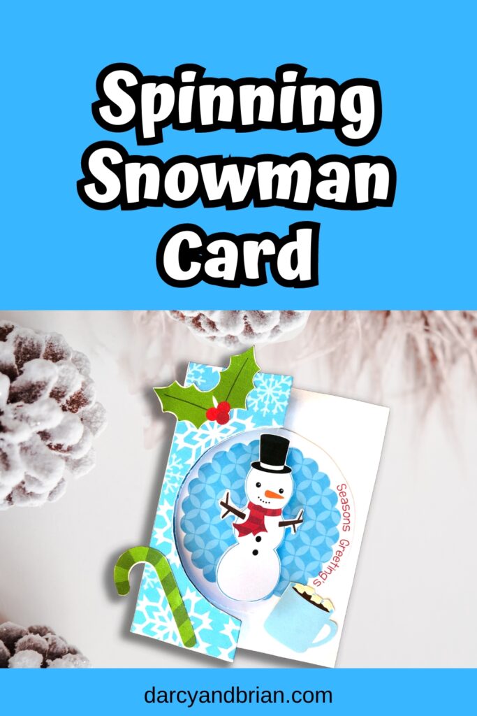 White text on blue background at the top says Spinning Snowman Card. Mockup of completed Christmas card on a snowy background.