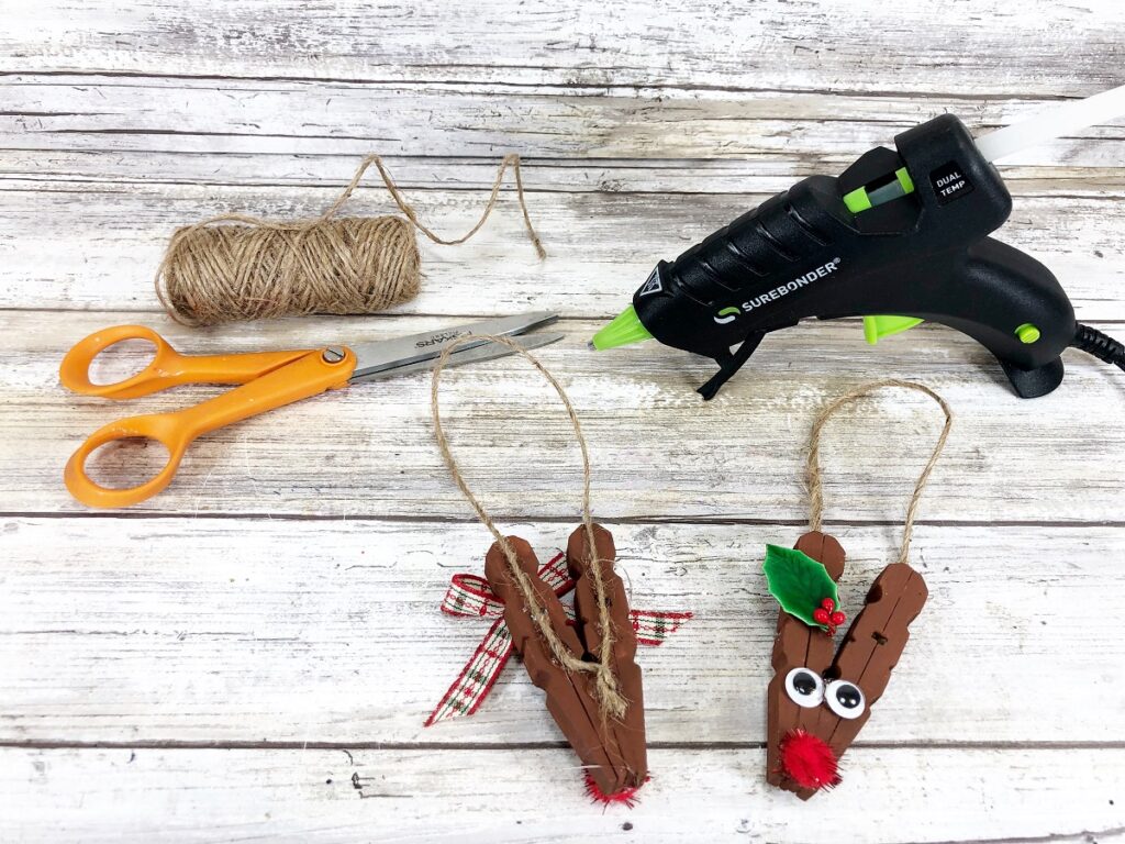 Showing where to glue the twine on the back of the clothespin reindeer to make it an ornament.