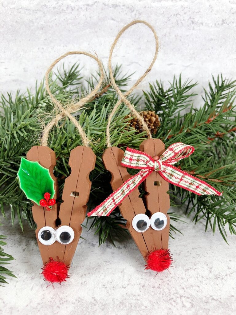 Two clothespin reindeer ornaments ready to hang up.