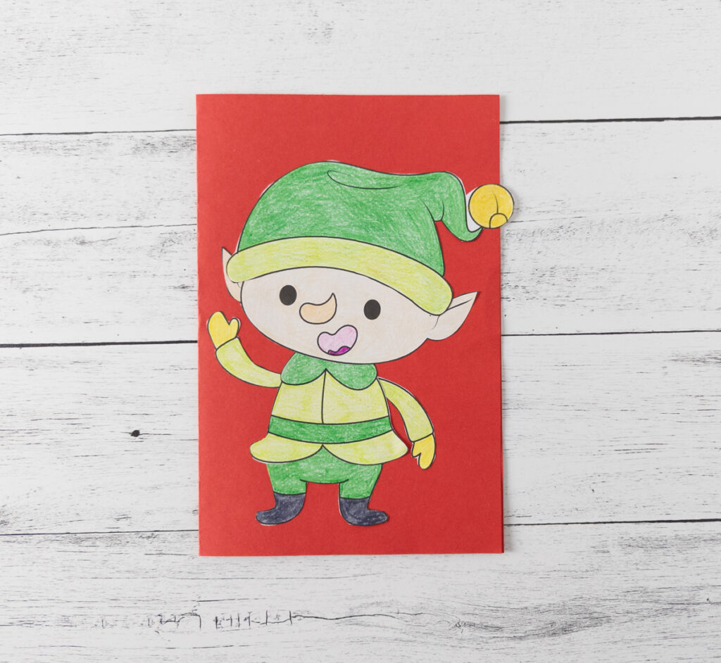 Completed printable elf craft made into a Christmas card.