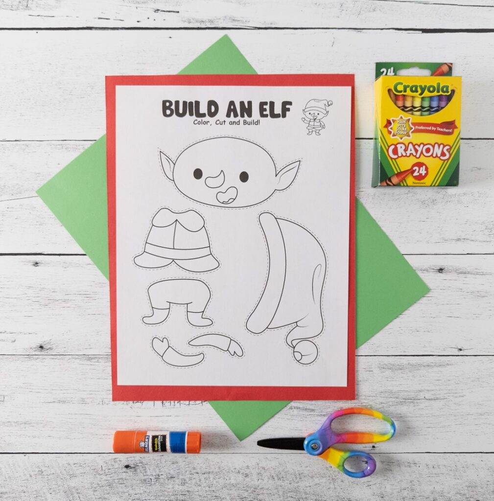 Items needed for printable cut and paste elf craft. Printable page, construction paper, glue stick, scissors, and crayons.