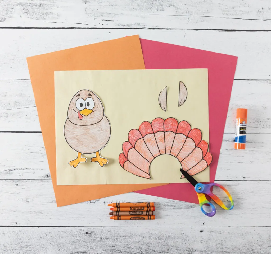 Turkey craft colored in and cut out with pieces on construction paper.