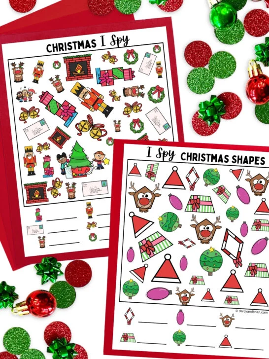 Mockup of the full color Christmas I Spy printable worksheets laying on red paper. Green and red circle confetti around the pages.