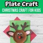 White text on green at the top says Reindeer Plate Craft Christmas Craft for Kids. Photo of completed reindeer made out of a paper plate laying on top of red and green construction paper.