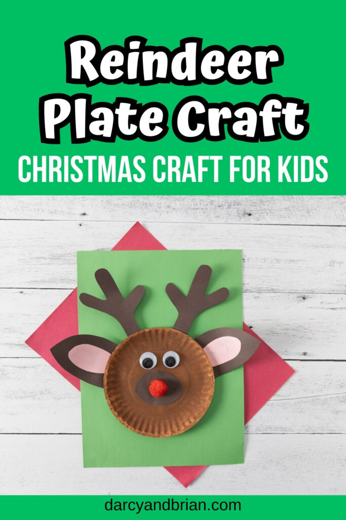 White text on green at the top says Reindeer Plate Craft Christmas Craft for Kids. Photo of completed reindeer made out of a paper plate laying on top of red and green construction paper.