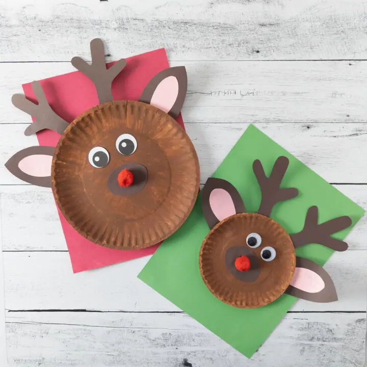 Two finished reindeer plate crafts made using different sized paper plates, paint, and construction paper.