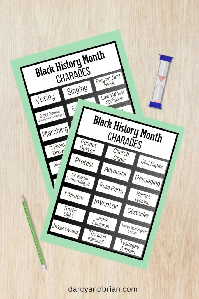 Mockup of two pages of Black History themed charades cards on a desk background. A pencil and sand timer lay on either said of the pages.