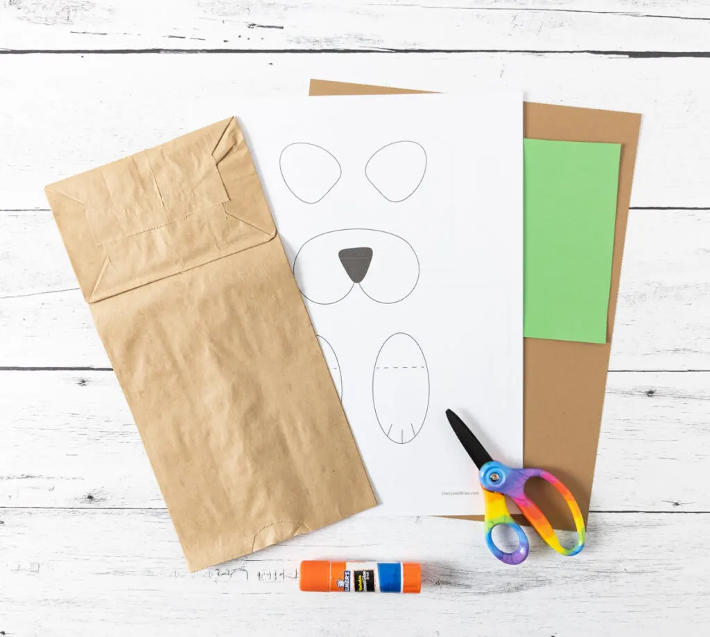 Craft materials to make a paper bag groundhog puppet.