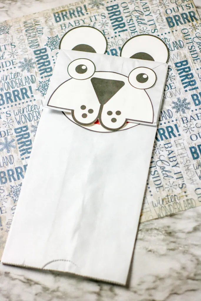 Completed polar bear kids craft made out of a paper bag.