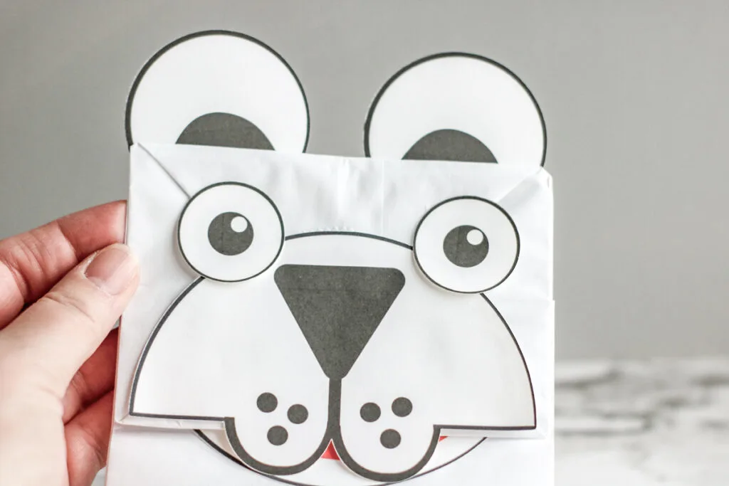 Close view of the polar bear paper bag puppet face.