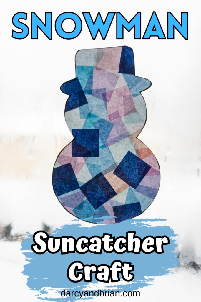 Completed snowman suncatcher craft made with tissue paper in a sunny window during winter.