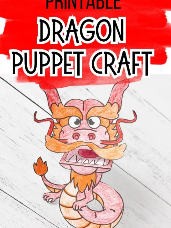 Completed printable dragon craft to make a red and orange dragon finger puppet.