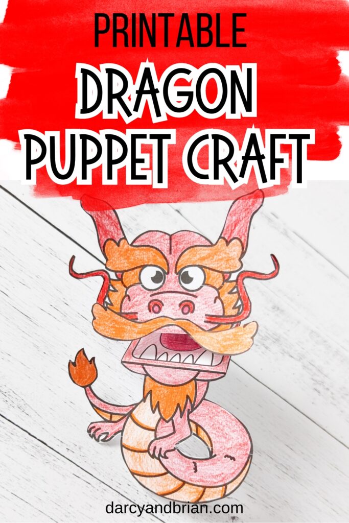 Completed printable dragon craft to make a red and orange dragon finger puppet.