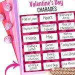 One page of Valentine charades on a stack of fanned out papers in pink, purple, and red colors. A few wrapped chocolates and pencils laying next to it.