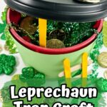 Shamrock decorated leprechaun trap made using an empty plastic coffee container.