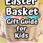 White text with black outline says Easter Basket Gift Guide for Kids. Below that is smaller black text over a pink splash says Non-Candy Items. Text is over a background of a child's hands holding out a wicker basket filled with colorful eggs.