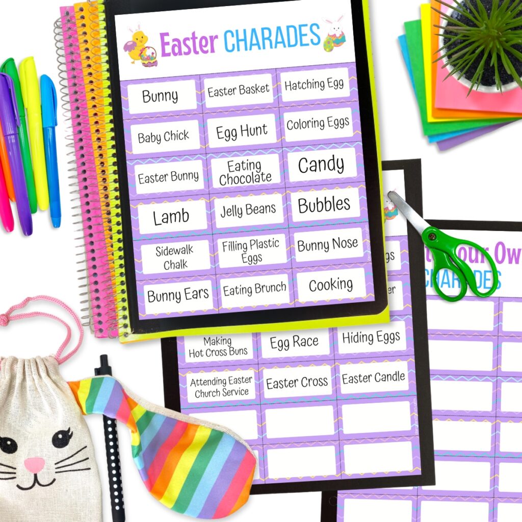 Mockup with two pages of pre-written Easter themed game cards for charades and a page with blank cards. Scissors, markers, and a bunny bag decorate the image around the pages.