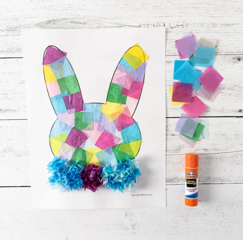 Easter bunny craft template covered with bright colors of tissue paper.