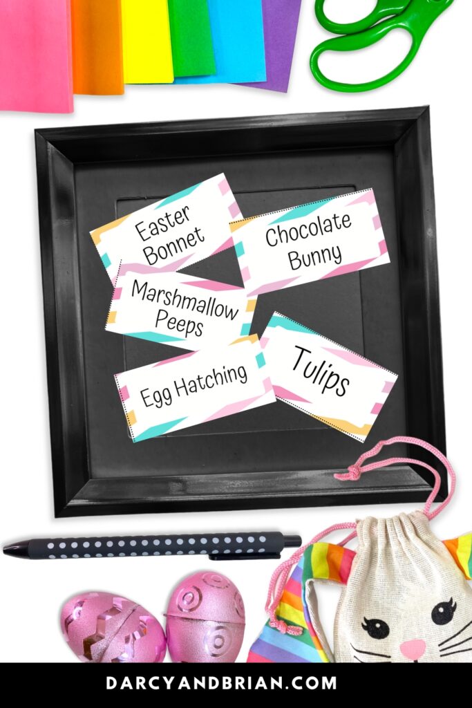 Mockup with five drawing prompt cards in a small black square bin. Easter eggs, bunny bag, and colorful paper decorate the image around the bin.