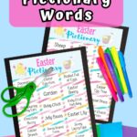 Mockup of printable Easter themed Pictionary game words laying on top of colorful construction paper. Pair of green handled scissors and markers laying over the pages. Name of game is at the top on a pink box.