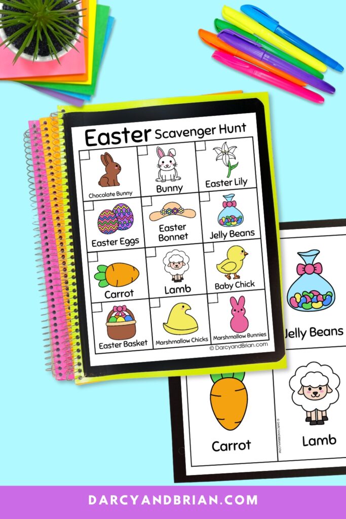 Mockup of Easter scavenger hunt with images and text on top of a stack of colorful notebooks and a page with scavenger item cards. Colorful pens along the side too.