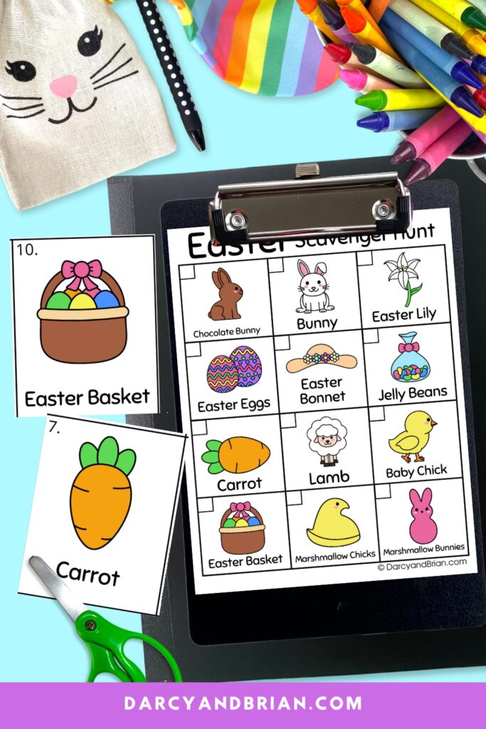 Easter themed scavenger hunt on a black clipboard with two cards next to the clipbard. Scissors next to the card. Bunny bag, pen, crayons along the top.
