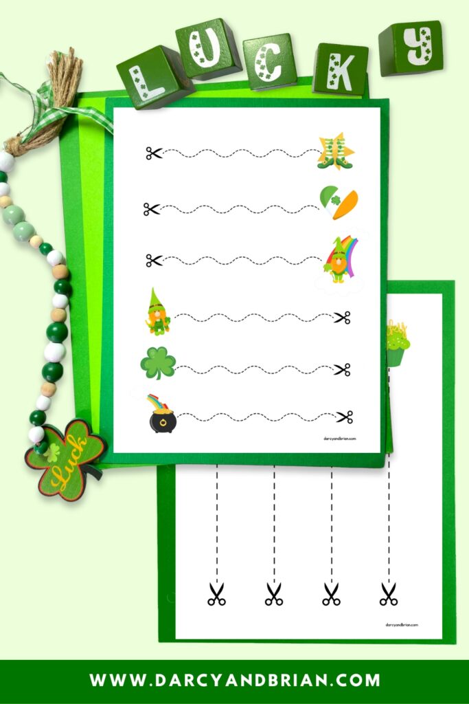 Digital mockup of straight and wavy cutting lines for kids on worksheets. Green blocks that spell "lucky" are along the top. Pages are on green paper.