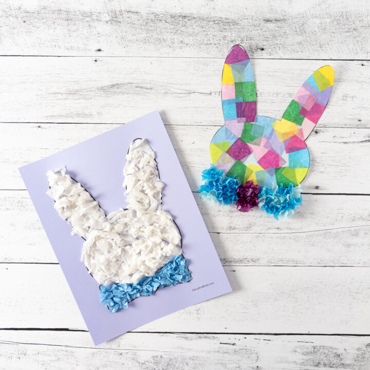 Two completed Easter bunny head crafts made with tissue paper.