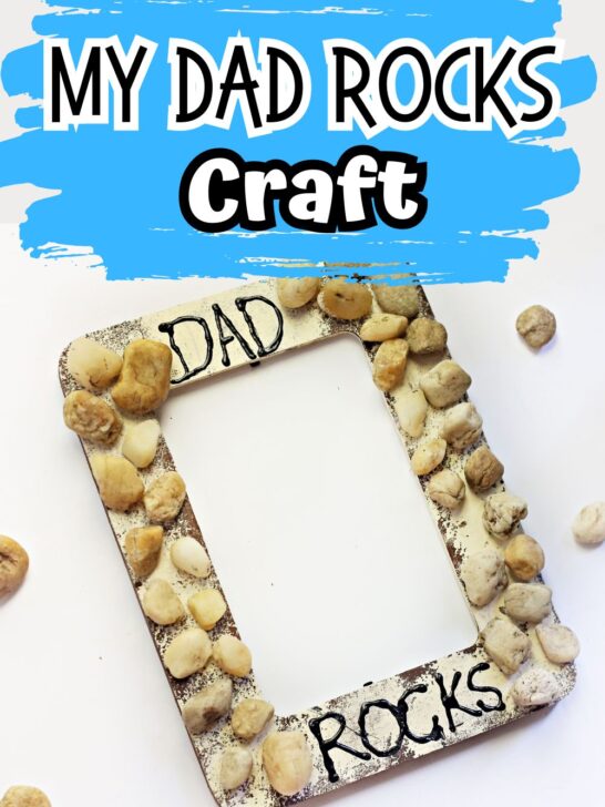 Top of image says My Dad Rocks Craft on blue background. Below is a photo of a wooden frame craft made with paint and gluing various stones on it.