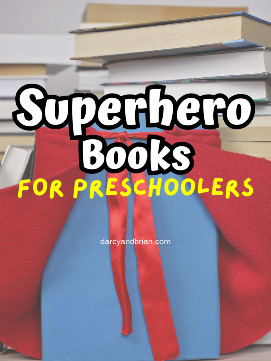 White text outlined in black says Superhero Books. Below in yellow text says For Preschoolers. Background shows stacks of books and one book has a red cape draped over it.